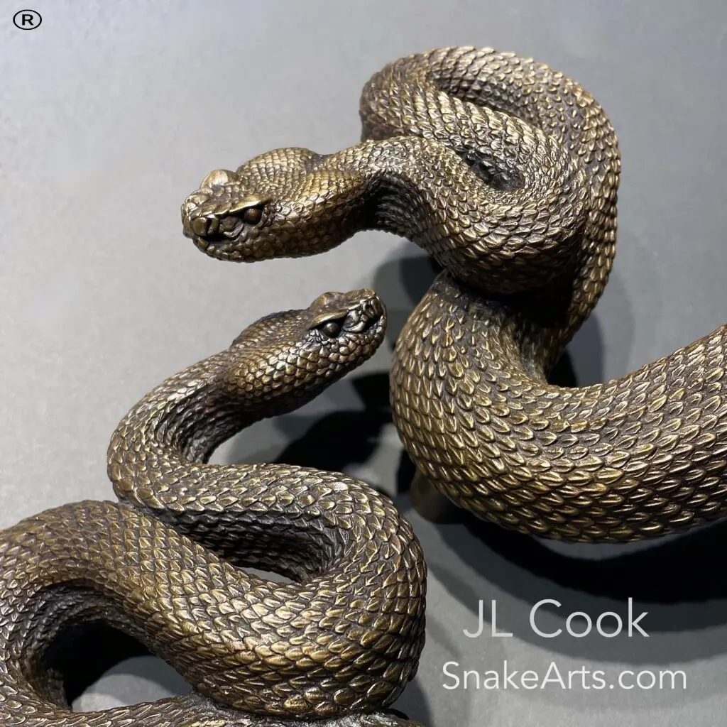 Two snake sculptures