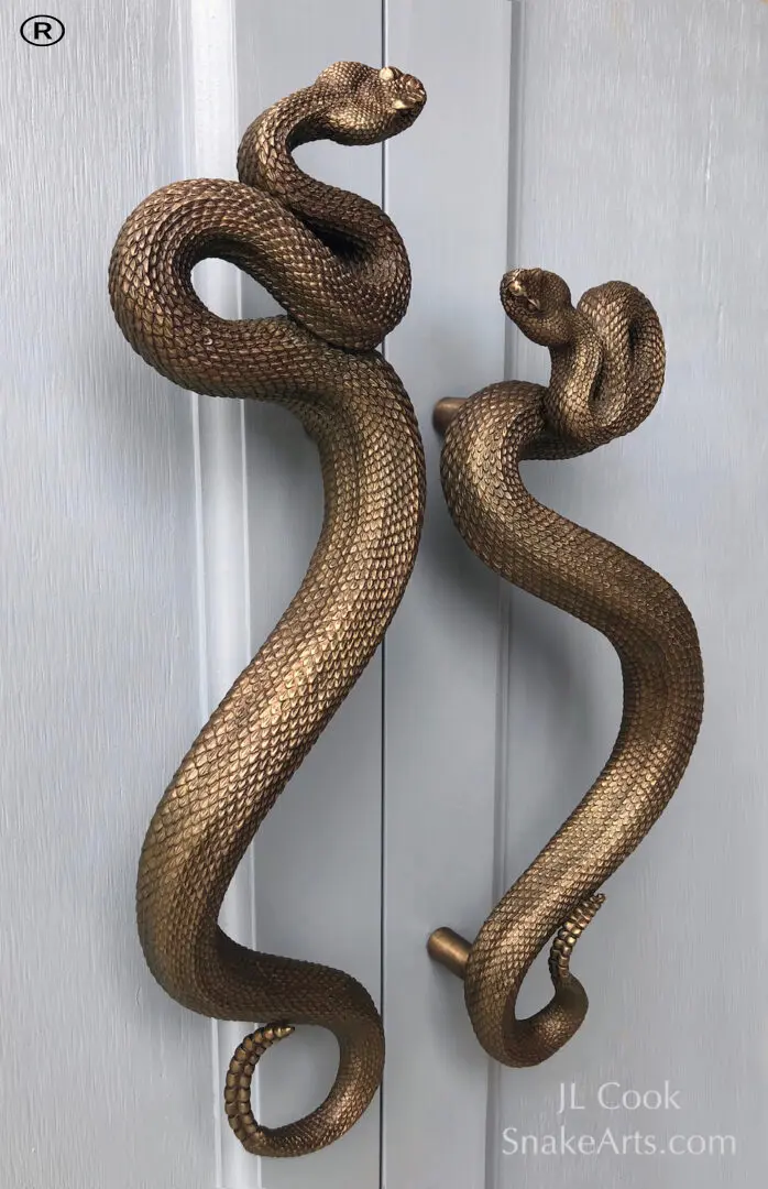 A pair of rattlesnake sculptures